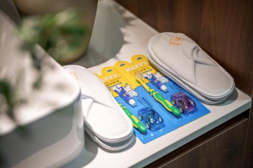 a pair of shoes and toy cars on a shelf at 清澜居 东方唐韵民宿酒店 in Xi'an