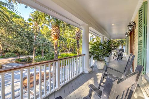 a porch with rocking chairs and a view of the street at MG3083: 3083 Marshgate in Seabrook Island