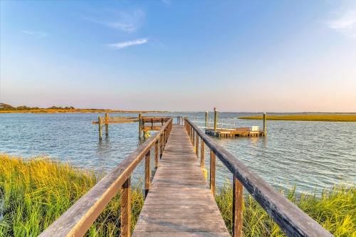 a wooden dock stretches out into a body of water at MG3083: 3083 Marshgate in Seabrook Island