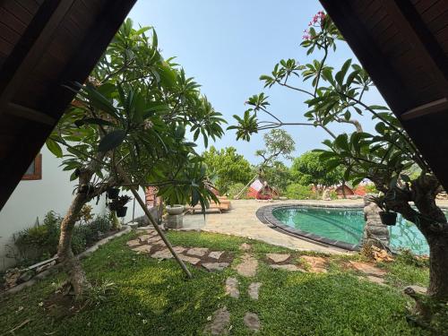 Πισίνα στο ή κοντά στο Ringsun Homestay Uluwatu