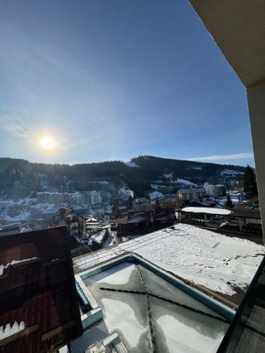 a view of a city from a building at Gold Palace SPA Resort Bukovel in Bukovel