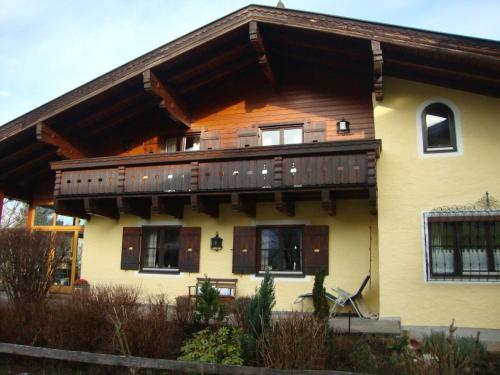 a house with a deck on the side of it at Landhaus Kurz in Golling an der Salzach