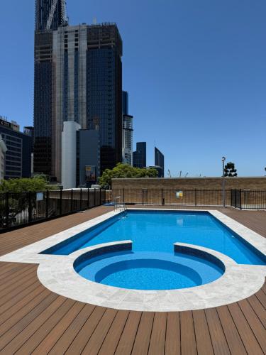 a swimming pool on the roof of a building at RiverView One-Bedroom Apartment Brisbane CBD in Brisbane