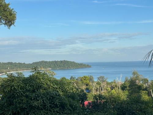 a view of a body of water with trees at David Hostel in Koh Rong