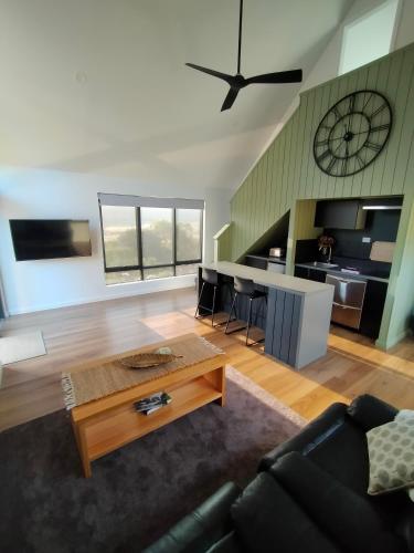 a living room with a couch and a table at Valley Views Retreat in Richmond