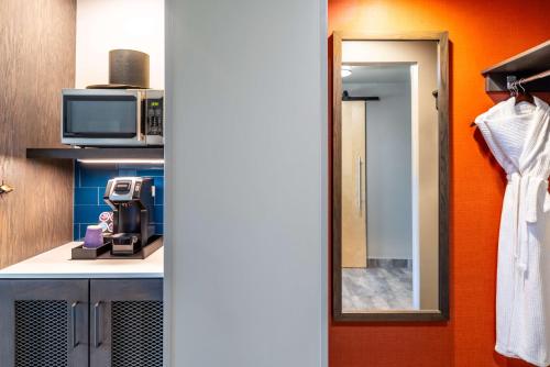 a bathroom with a sink and a microwave at Hilton Garden Inn Fredericton in Fredericton