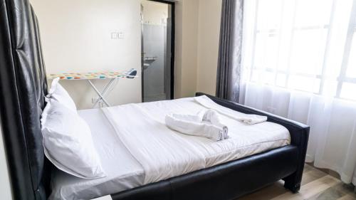 Katil atau katil-katil dalam bilik di Cosy Flamingo furnished apartments