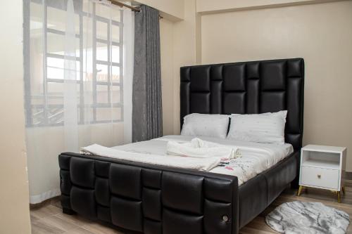 Postel nebo postele na pokoji v ubytování Cosy Flamingo furnished apartments