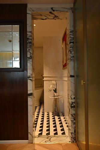 a hallway with a sink in a room at The Townhouse Hotel - Small Luxury Hotels of the World in Islamabad