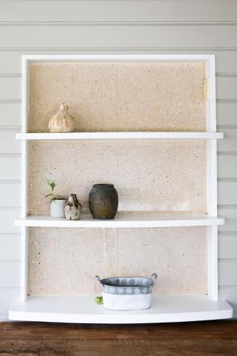 a white shelf with some items on it at Heavenly Palms on Collinson in Westcourt