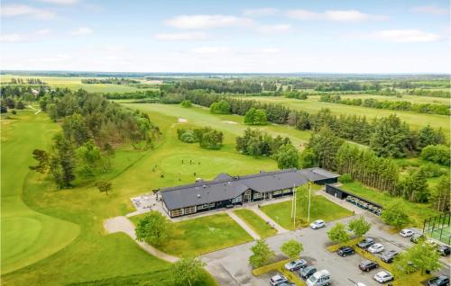 an aerial view of a building with a golf course at Beautiful Home In Pandrup With Wifi in Pandrup