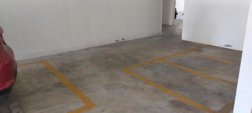 an empty room with yellow lines on the floor at Aisy Homestay in Kuala Terengganu