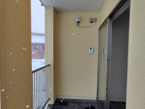 an empty hallway of a building with a elevator at BBQ 夏季プール マッサージチェア 舞子スノーリゾート 加賀屋旅館 南魚沼 Kagaya Ryokan 加贺屋旅馆 in Minami Uonuma