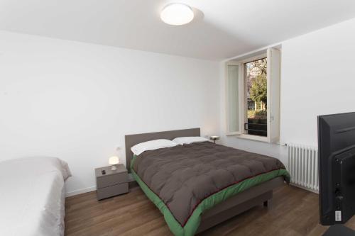 Postel nebo postele na pokoji v ubytování Max Rooms Bergamo