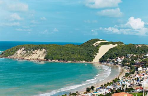 an aerial view of a beach with a mountain at Comfort Hotel & Suites Natal in Natal