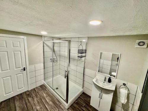 a bathroom with a shower and a sink at Gloucester Haven Retreat in Gloucester