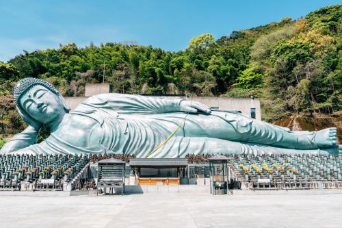 a large statue of a reclining woman in aiseum at WeBase Hakata Hostel in Fukuoka