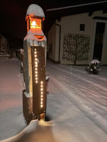 a light in the snow with lights on it at Alpine Lodge Brixen in Brixen im Thale