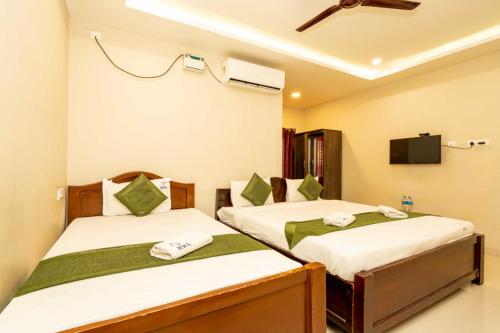 Postel nebo postele na pokoji v ubytování Hotel Ramleela