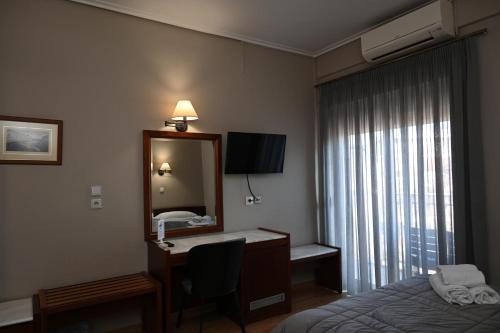 Postel nebo postele na pokoji v ubytování Hotel Achillion