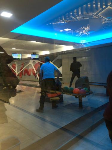 a man playing bowling in a bowling alley at Zaži Chalupa Liptovska Osada in Liptovská Osada