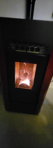 a small oven with a fire inside of it at LA CASETTA DI SILVIA in Villetta Barrea