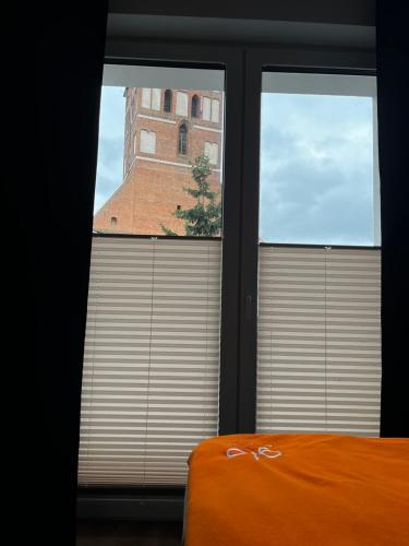 Ένα ή περισσότερα κρεβάτια σε δωμάτιο στο Pokoje gościnne FABIO II
