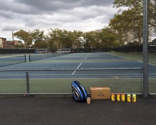a tennis court with a net and some boxes on the ground at Perfect Business Penthouse 3BR Near NYC in Union City