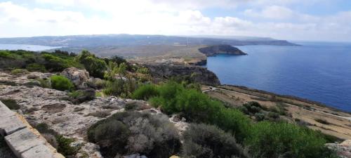 a view of a large body of water at Side Sea View D, Steps Away to Bugibba Jetty, For the Blue Lagoon Boats and Other Islands in St Paul's Bay