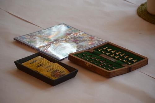 two boxes of dominoes are sitting on a table at Sudhaksha Celebrations in Prayagraj