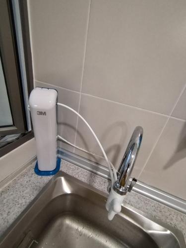 a kitchen sink with a water faucet next to aaucet at Palas Horizon Home B-7-11 in Brinchang