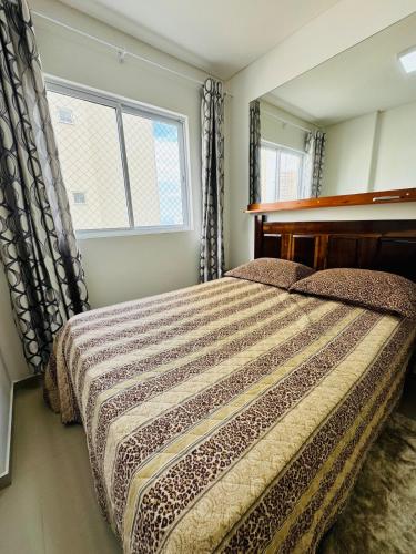 Ένα ή περισσότερα κρεβάτια σε δωμάτιο στο Mirante do mar