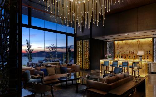 a lobby with couches and a bar with a view at Phuket V Building 19 Villas with Andaman Sea View Private Swimming Pool and Spa in Ban Ao Makham