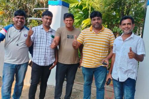 a group of men giving the thumbs up at Blue Bell Homestay in Udupi