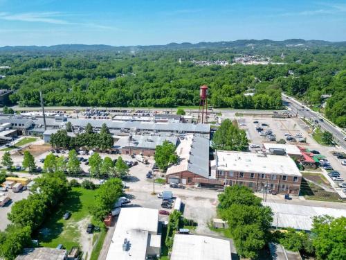an aerial view of a parking lot with a water tower at Pretty and Bright Historic Franklin Quadplex in Franklin