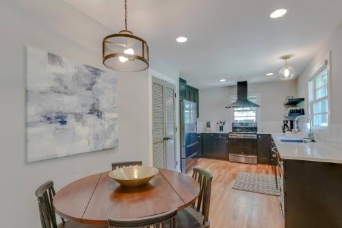 a kitchen and dining room with a wooden table and chairs at Lovely Three Bedroom Home Historic Franklin Quadplex in Franklin