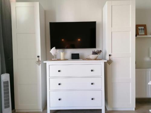 Télévision ou salle de divertissement dans l'établissement Appartment Alicja