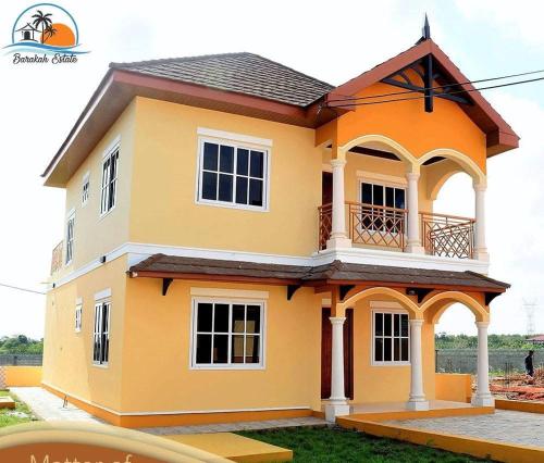 a model of a house in the yard at Zaynab Space Aminah Luxury Rentals in Serekunda