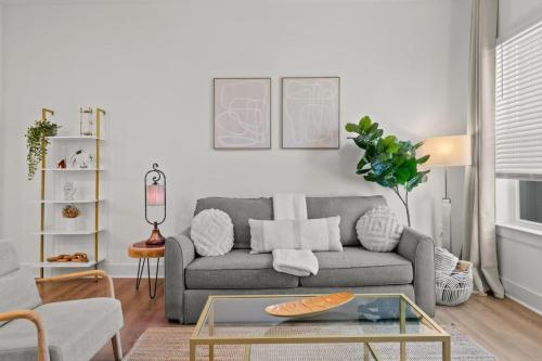 a living room with a couch and a table at Relax and Unwind near Downtown Tampa in Tampa