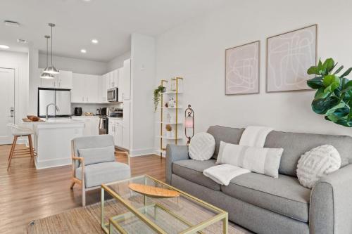 a living room with a couch and a table at Relax and Unwind near Downtown Tampa in Tampa