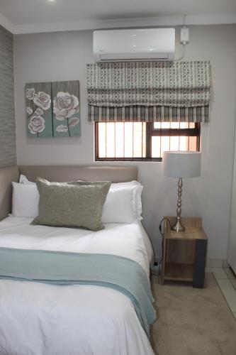 Ένα ή περισσότερα κρεβάτια σε δωμάτιο στο Cronin Luxury Accomodation Room 2
