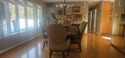 a dining room with a table and chairs at Escape to the Catskills in Liberty
