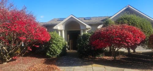 a house with red trees in front of it at Escape to the Catskills in Liberty