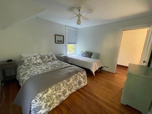 a bedroom with two beds and a window at Sunfish Cove is the perfect year round getaway in Monmouth