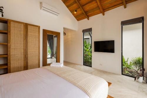 TV a/nebo společenská místnost v ubytování Bahia Rooms