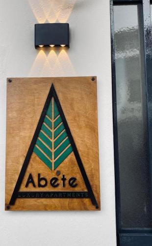 a sign on a wall with a aloe sign at Abete Luxury Apartments in Metsovo