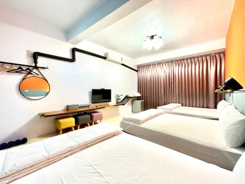 Postel nebo postele na pokoji v ubytování SNUG·NINE Hotel