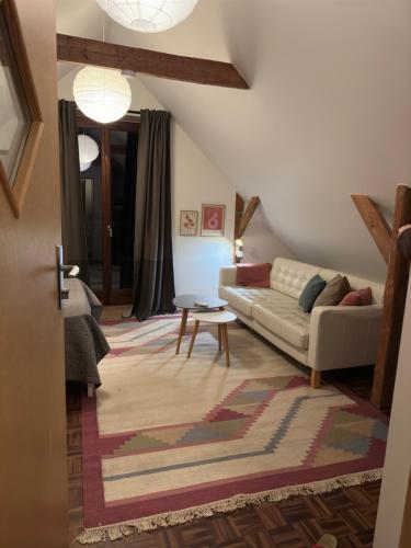 a living room with a couch and a table at Hegnsly in Odder