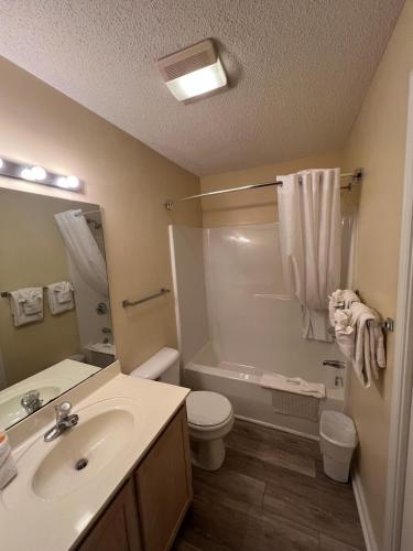 a bathroom with a sink and a toilet and a shower at Cherry Grove 1BR screened porch 2nd Floor view in Myrtle Beach