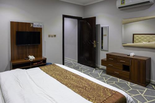 Ein Bett oder Betten in einem Zimmer der Unterkunft رمال الجزيره
